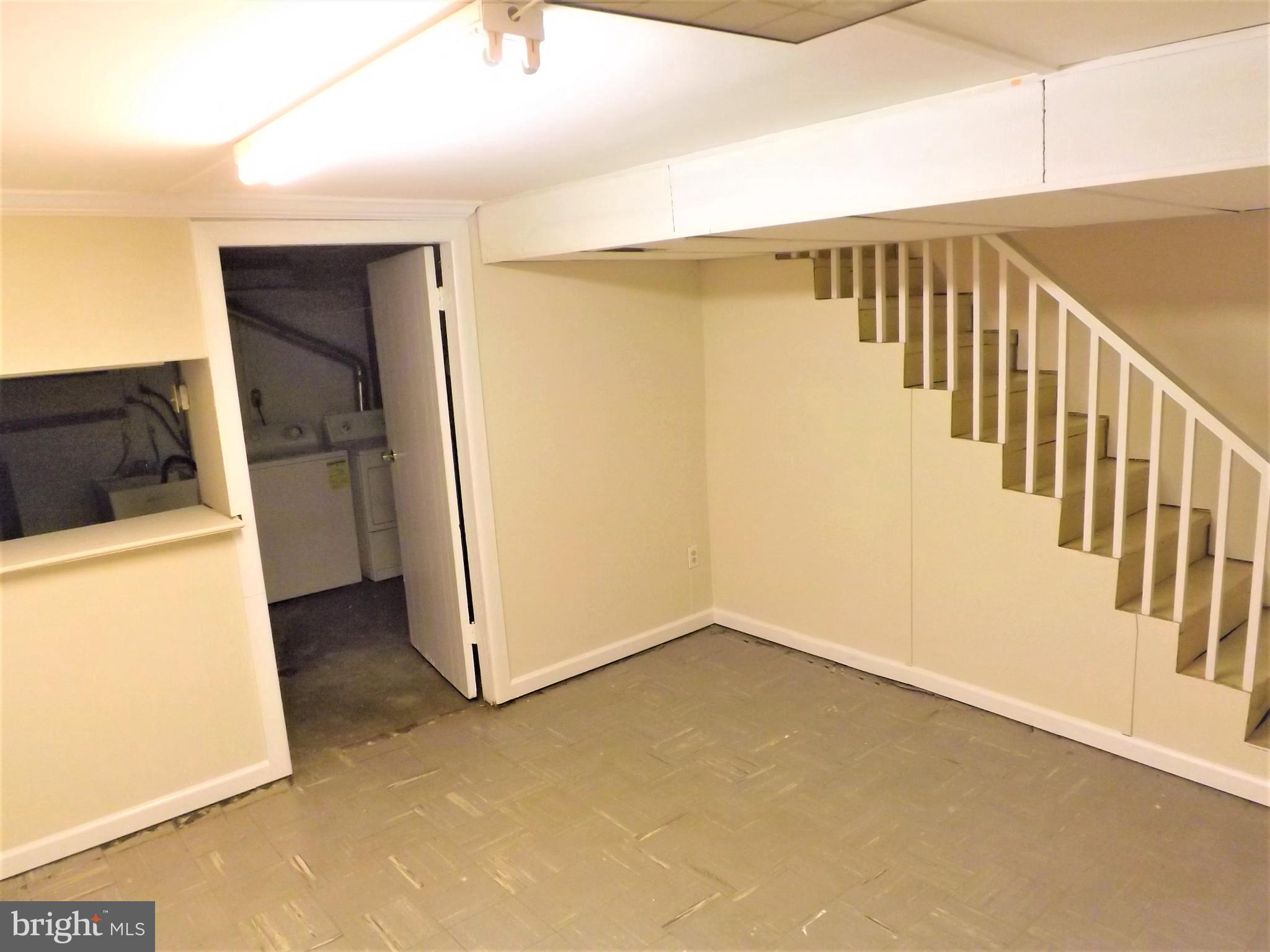 11936 Bluhill Road Silver Spring, MD 20902 - Photo 23 of 30 a view of a hallway with wooden floor and entryway