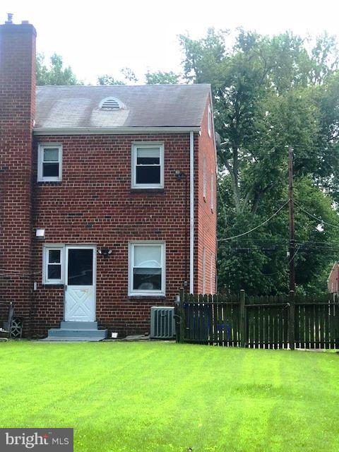 11936 Bluhill Road Silver Spring, MD 20902 - Photo 25 of 30 a front view of a house with a yard