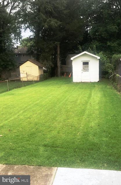 11936 Bluhill Road Silver Spring, MD 20902 - Photo 26 of 30 a backyard of a house with lots of green space