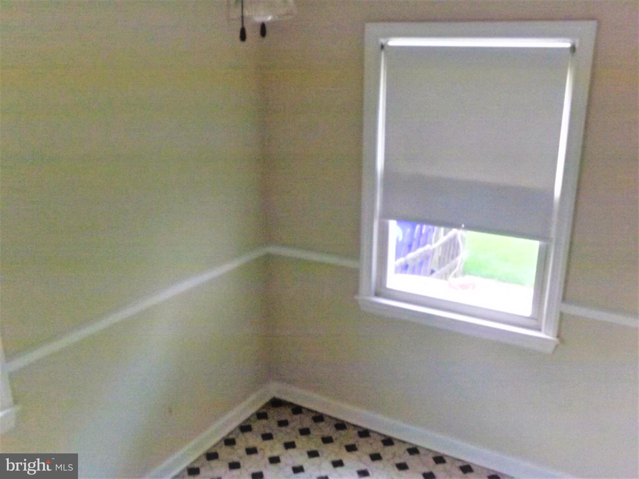 11936 Bluhill Road Silver Spring, MD 20902 - Photo 8 of 30 a bathroom with a window