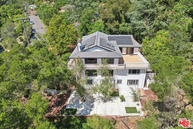 a backyard of a house with lots of green space