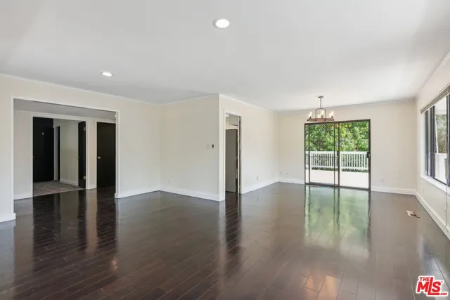 a kitchen with a refrigerator a stove a sink and a window