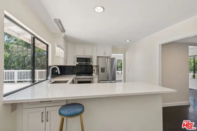 a view of livingroom with window and hardwood floor