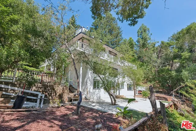 a view of a green field with lots of bushes
