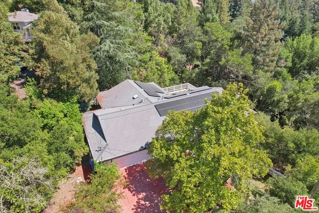 aerial view of a house with a yard