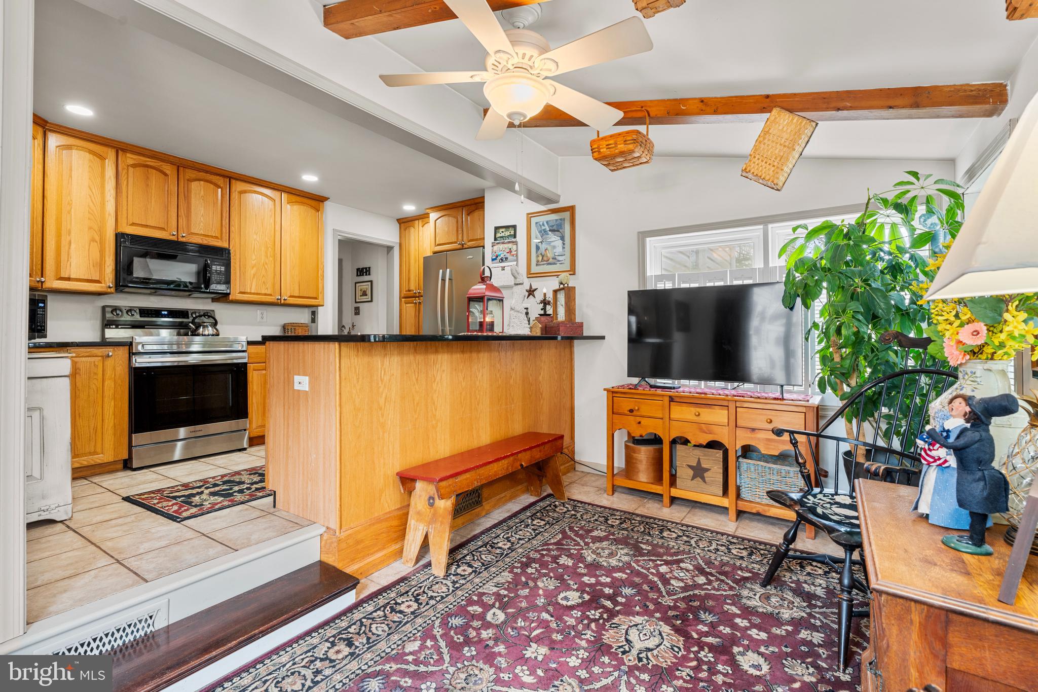 524 Scott Road Perkasie, PA 18944 - Photo 12 of 38 a living room with furniture a flat screen tv and a table