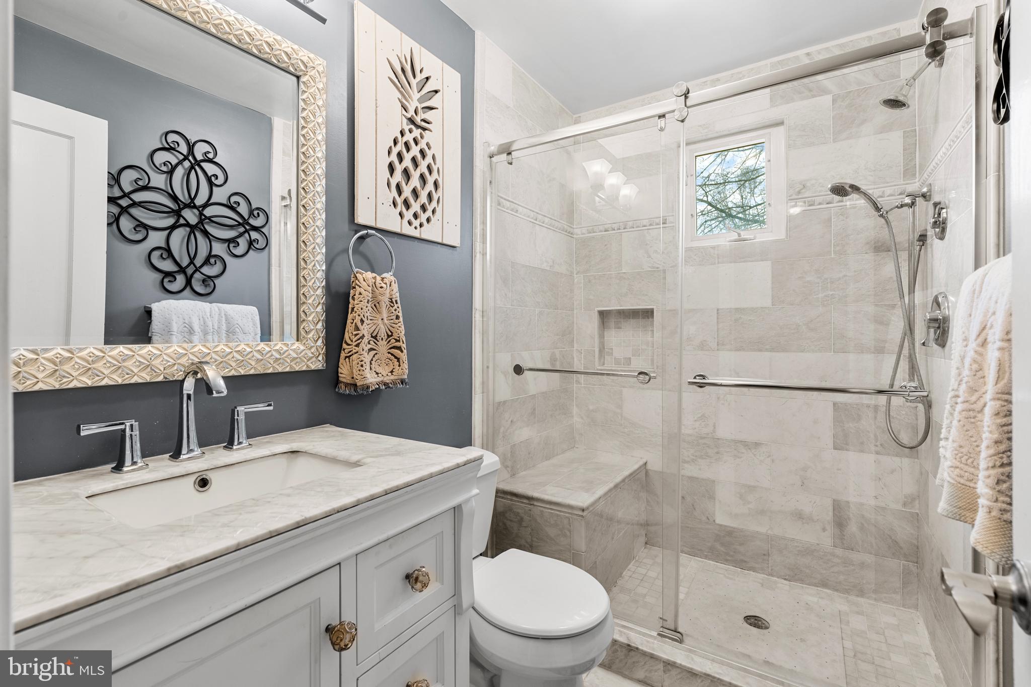 524 Scott Road Perkasie, PA 18944 - Photo 16 of 38 a bathroom with a granite countertop sink a toilet and shower