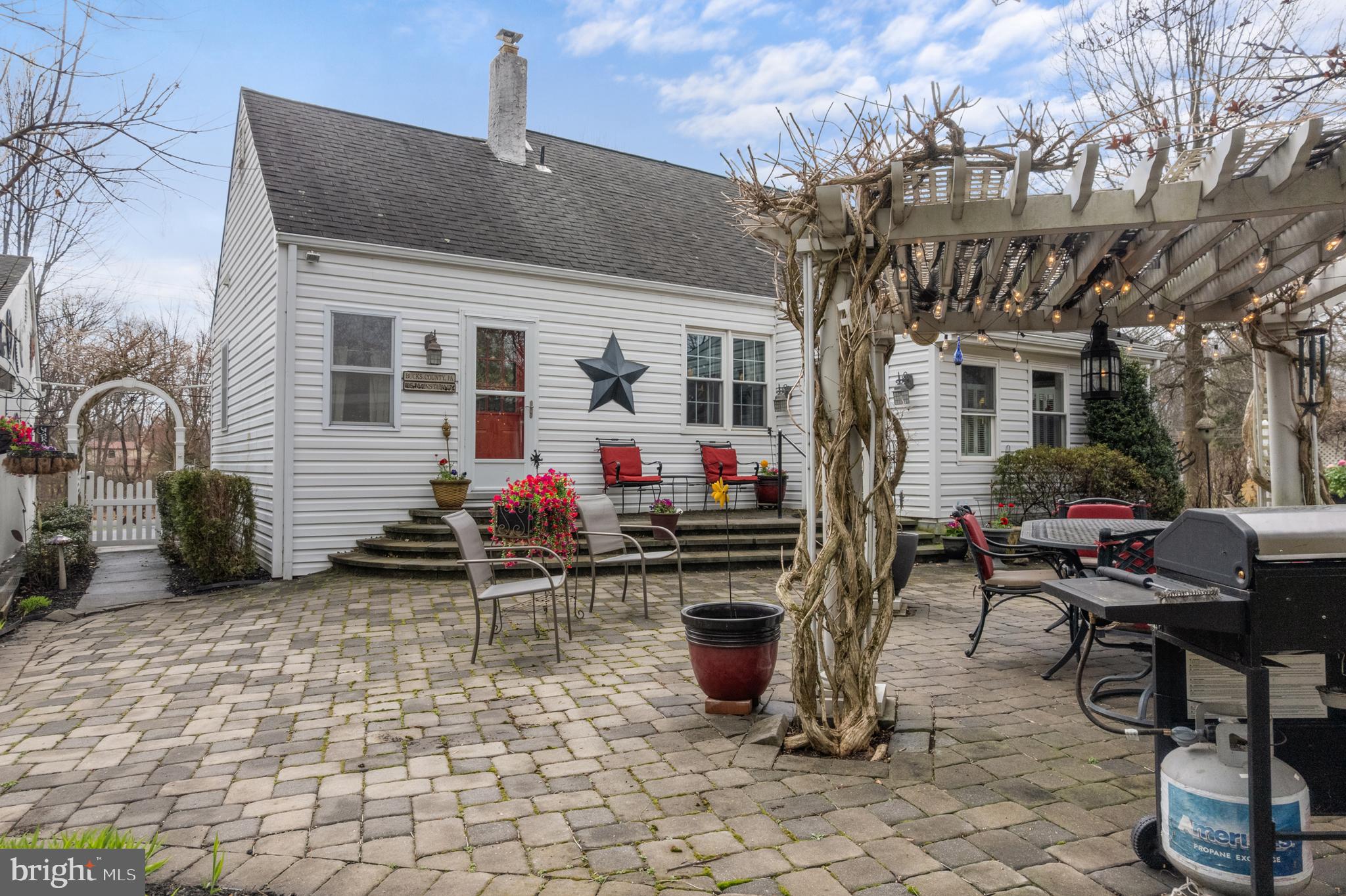 524 Scott Road Perkasie, PA 18944 - Photo 32 of 38 a group of people sitting in front of a house
