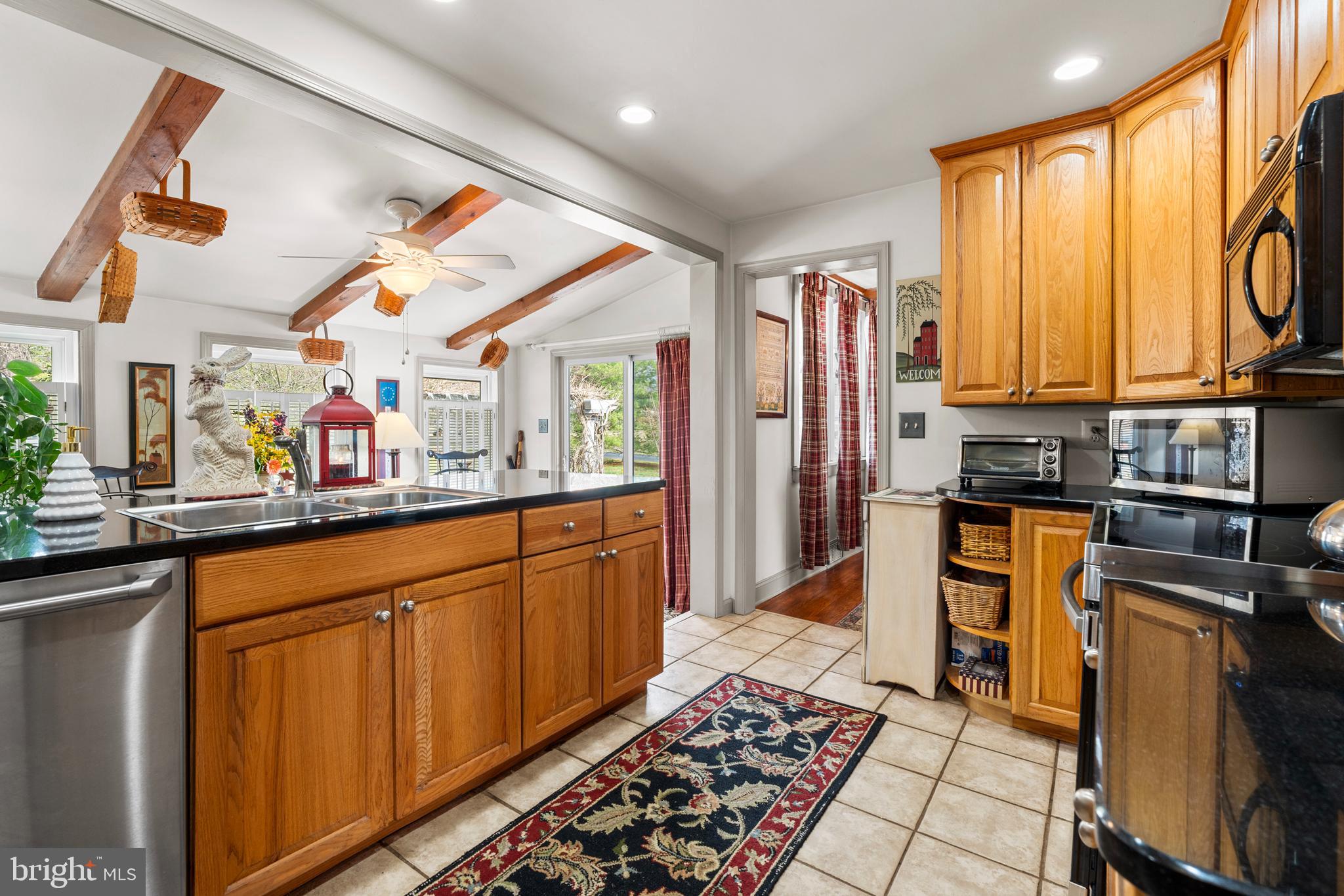 524 Scott Road Perkasie, PA 18944 - Photo 9 of 38 a kitchen with stainless steel appliances granite countertop a refrigerator and a stove top oven