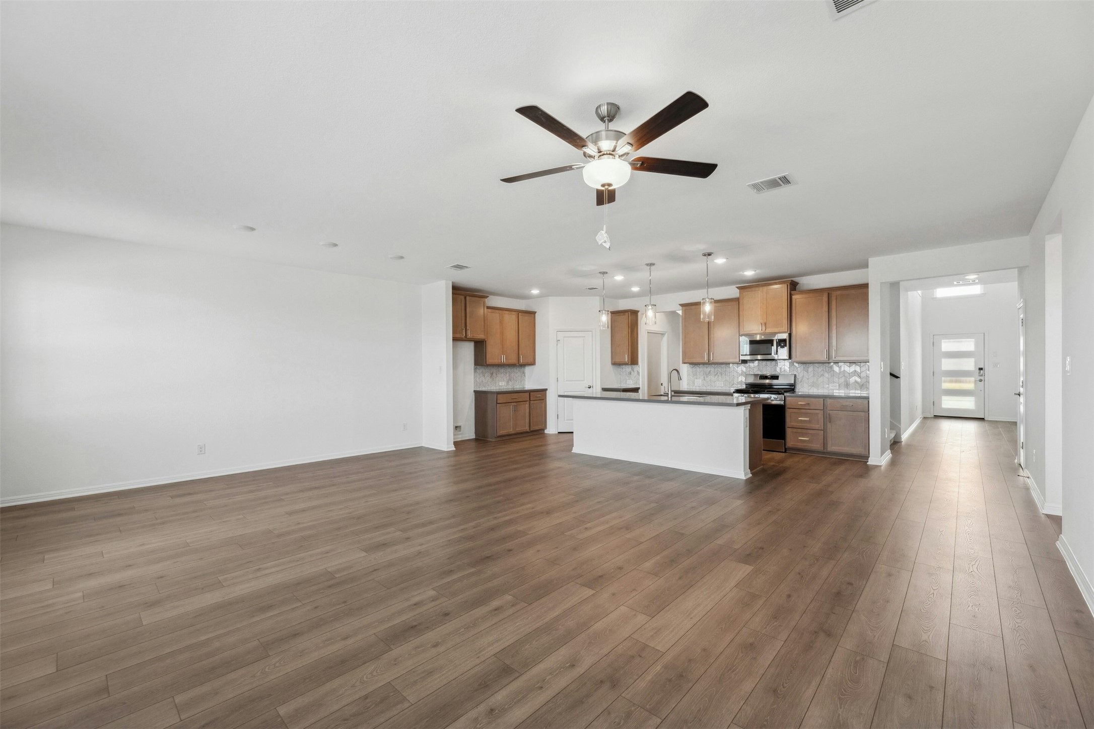 2001 Wynn Road Hutto, TX 78634 - Photo 38 of 39 An open floorplan seamlessly connects the living space to a well-appointed kitchen, ideal for entertaining.