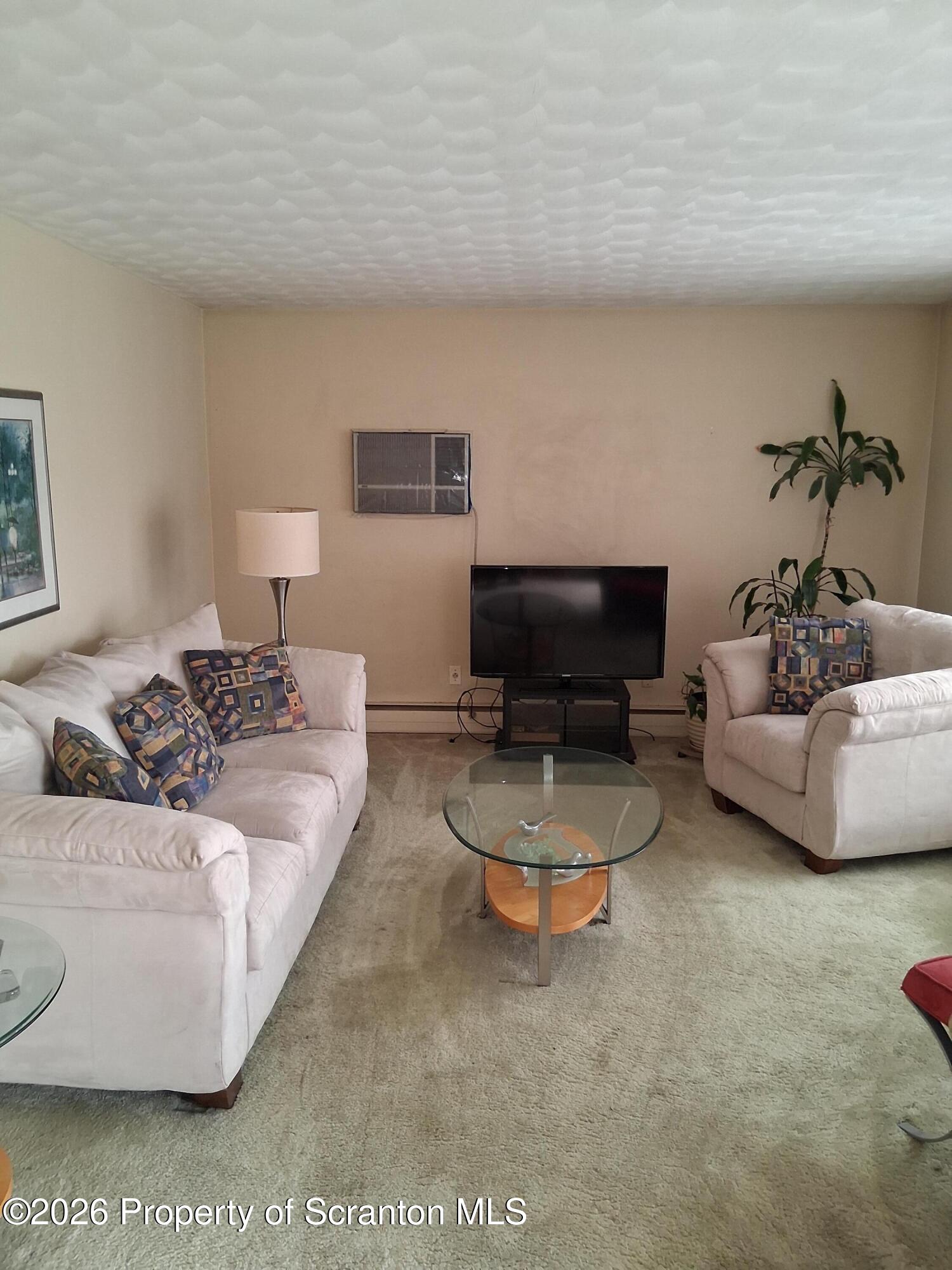 5 Monarch Road Wilkes Barre, PA 18706 - Photo 12 of 35 a living room with furniture and a flat screen tv