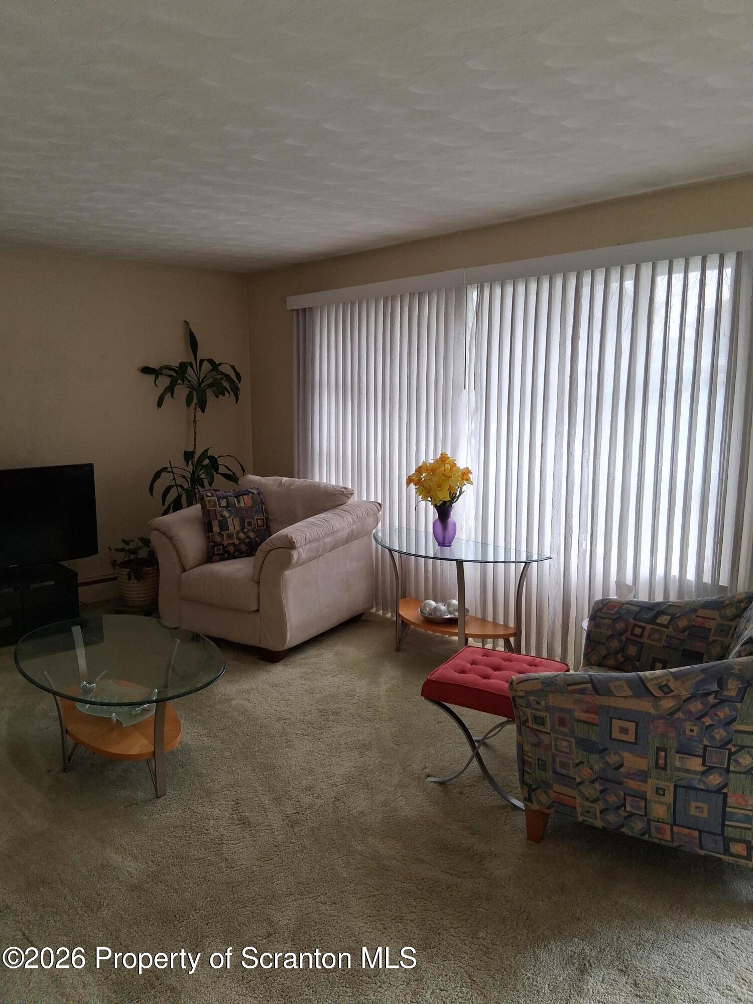 5 Monarch Road Wilkes Barre, PA 18706 - Photo 13 of 35 a living room with furniture a rug and a window