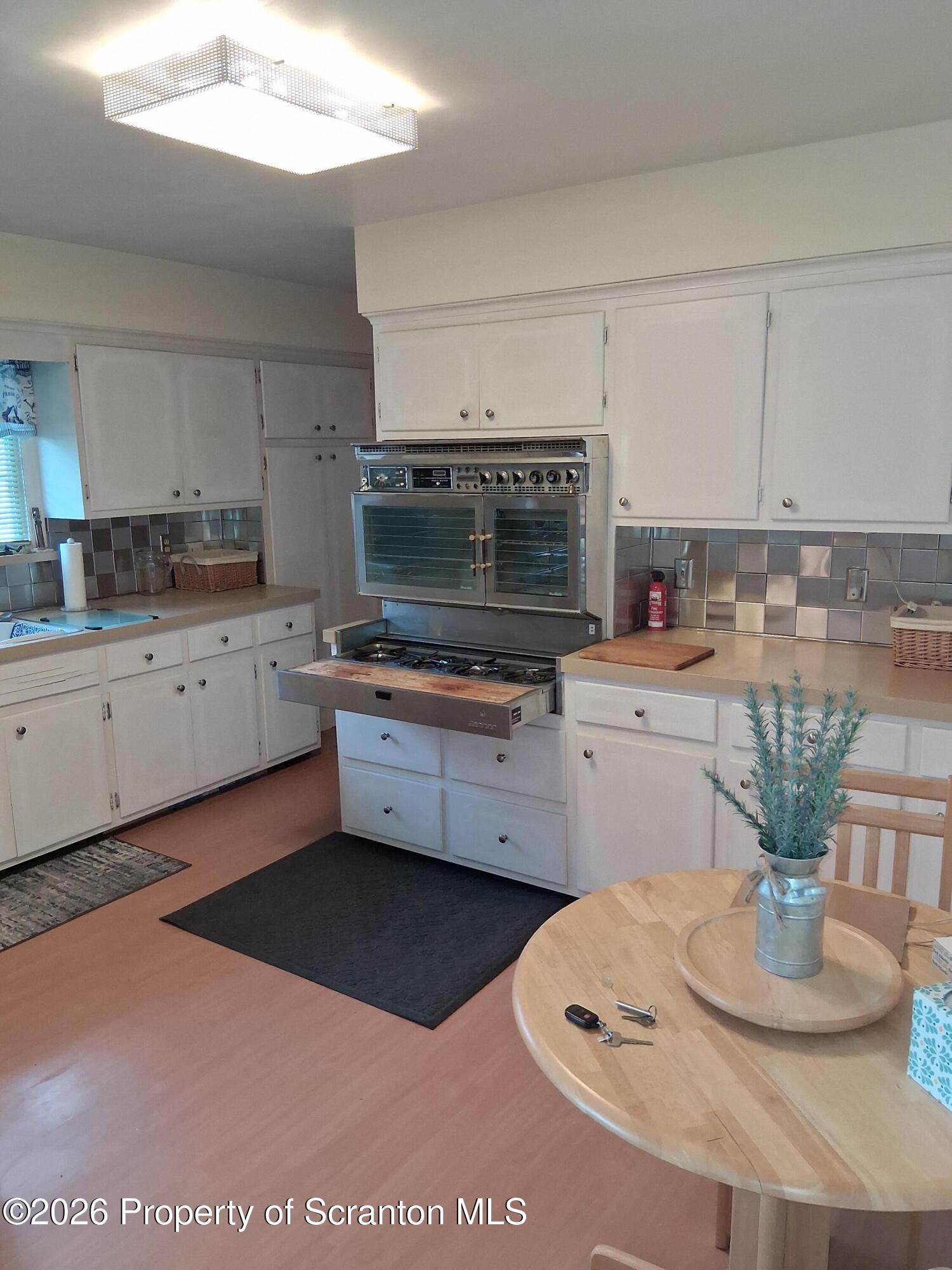 5 Monarch Road Wilkes Barre, PA 18706 - Photo 18 of 35 a kitchen with a sink a stove and cabinets