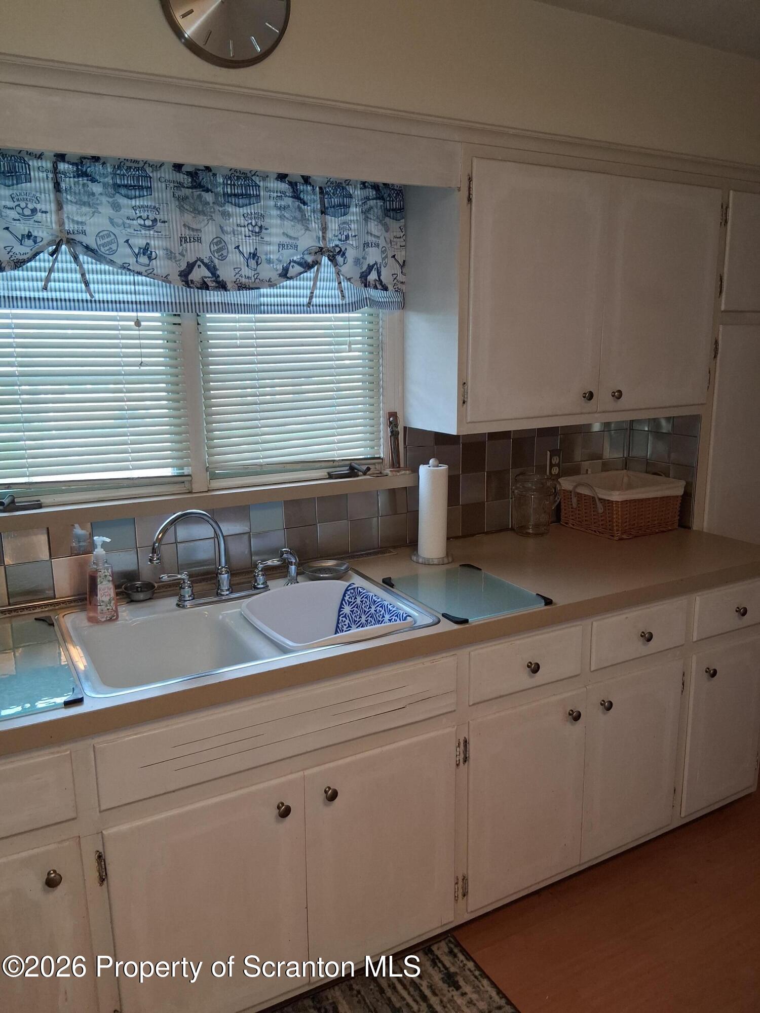 5 Monarch Road Wilkes Barre, PA 18706 - Photo 20 of 35 a kitchen with granite countertop white cabinets and sink