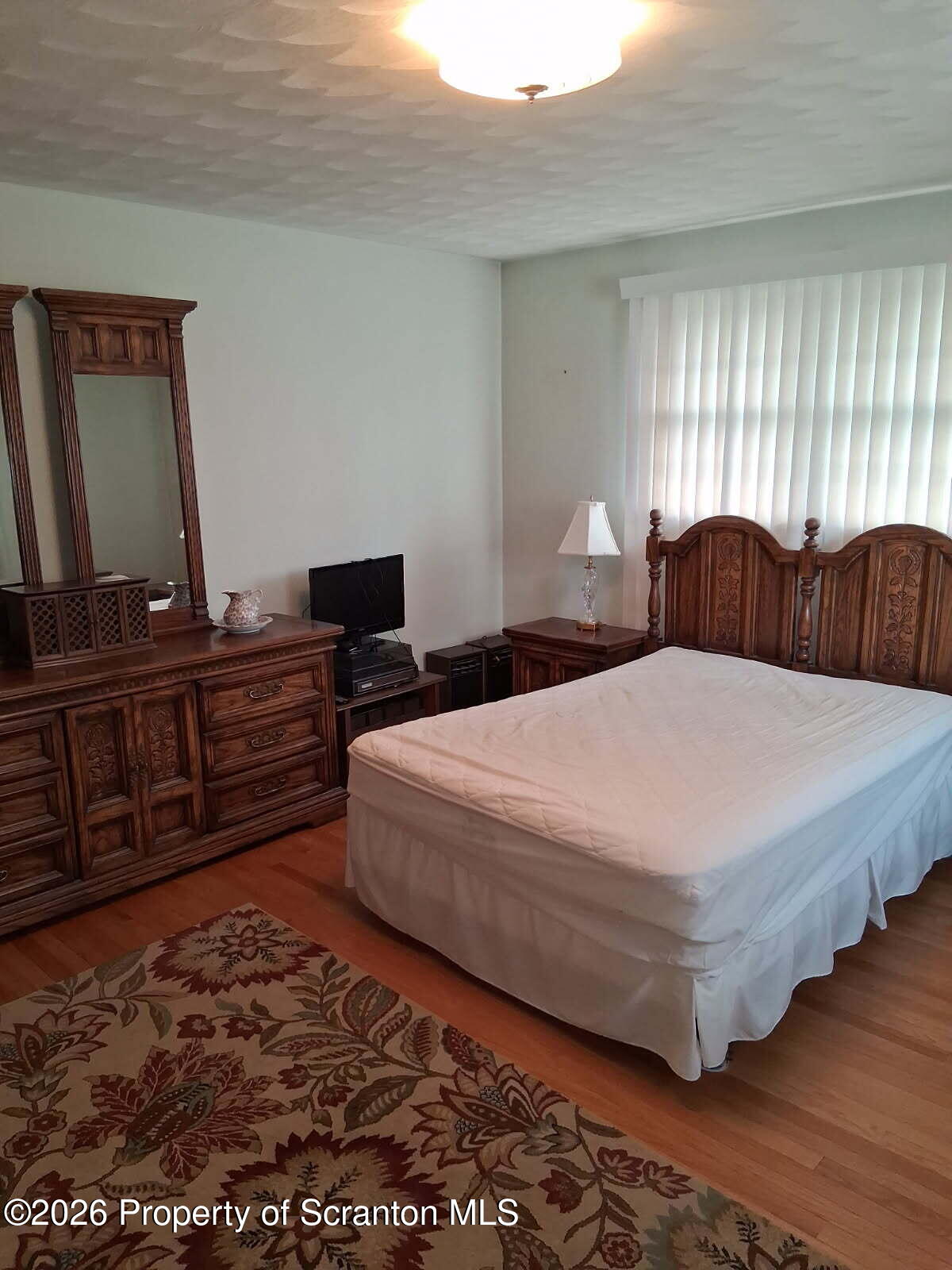 5 Monarch Road Wilkes Barre, PA 18706 - Photo 21 of 35 a bedroom with a bed and dresser with wooden floor