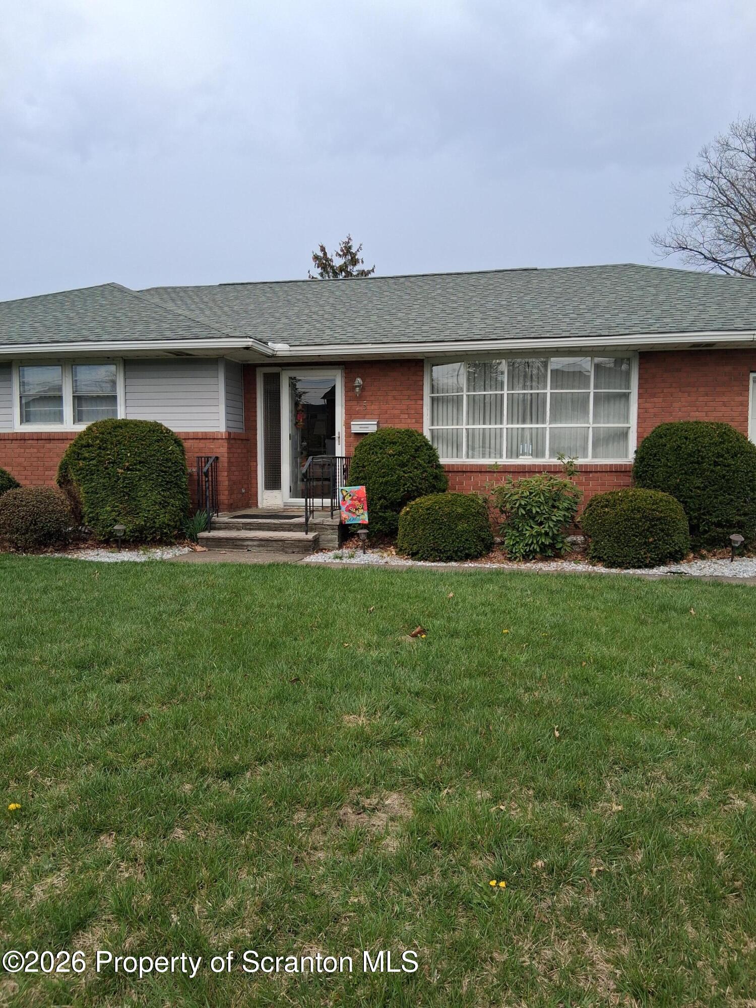 5 Monarch Road Wilkes Barre, PA 18706 - Photo 3 of 35 a front view of a house with a yard and garage