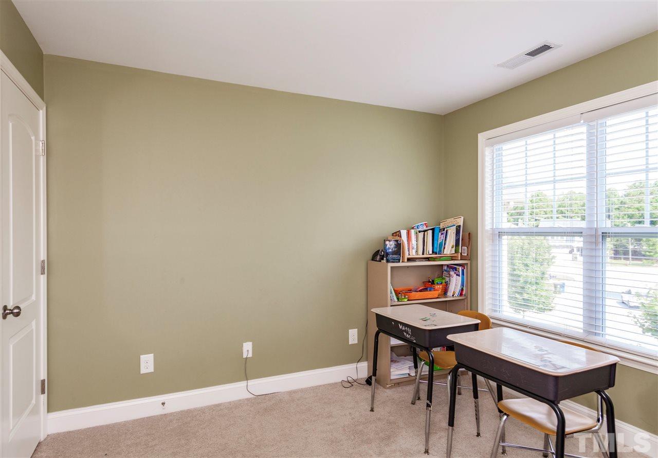 5607 Spring Glen Lane Raleigh, NC 27616 - Photo 13 of 21 a view of a workspace with furniture and a window