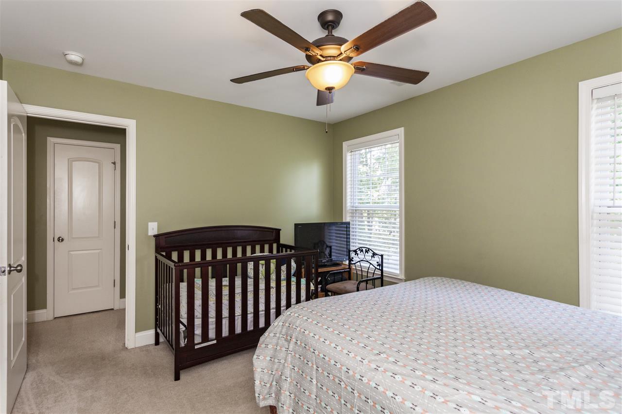 5607 Spring Glen Lane Raleigh, NC 27616 - Photo 14 of 21 a bedroom with a bed and a window