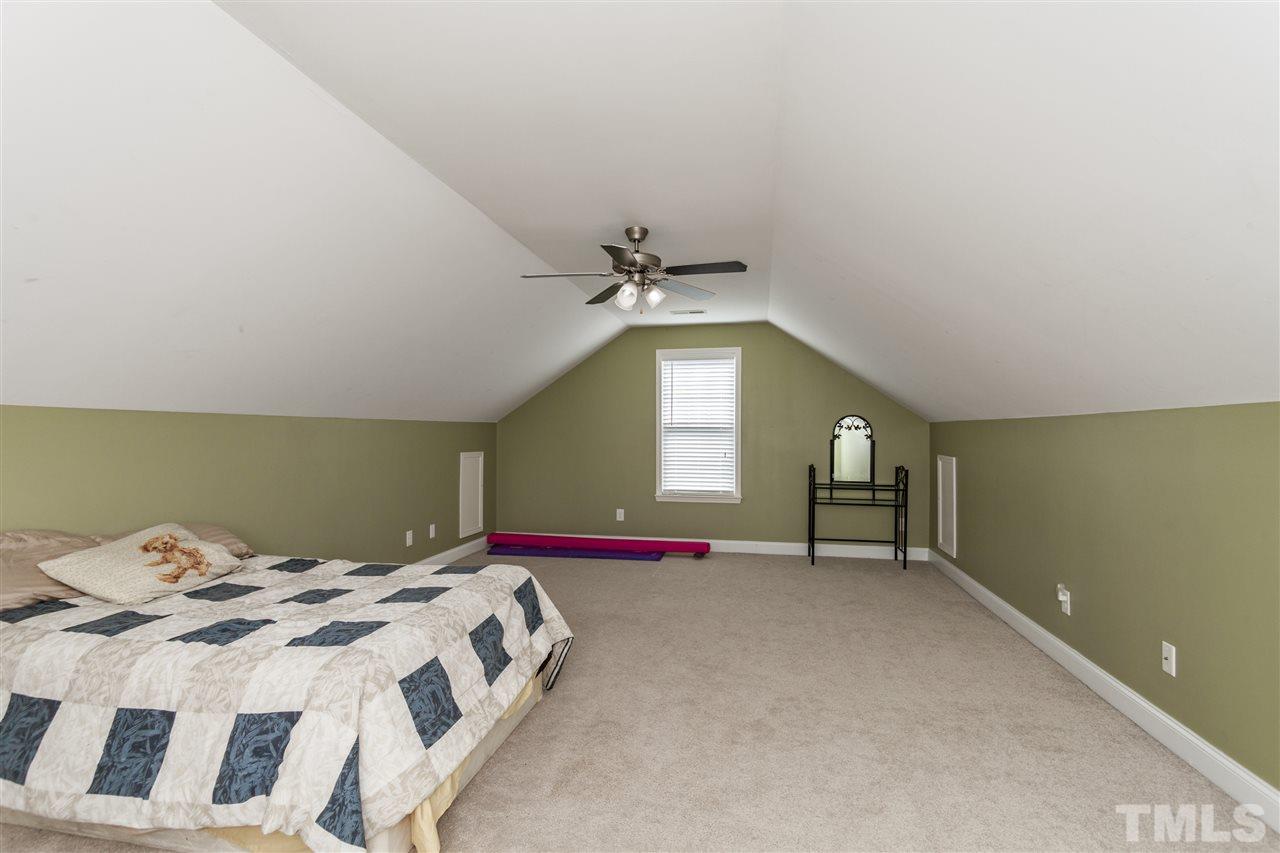 5607 Spring Glen Lane Raleigh, NC 27616 - Photo 18 of 21 a bedroom with a bed and a window