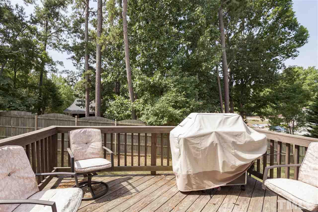 5607 Spring Glen Lane Raleigh, NC 27616 - Photo 19 of 21 a view of balcony with wooden floor and outdoor seating