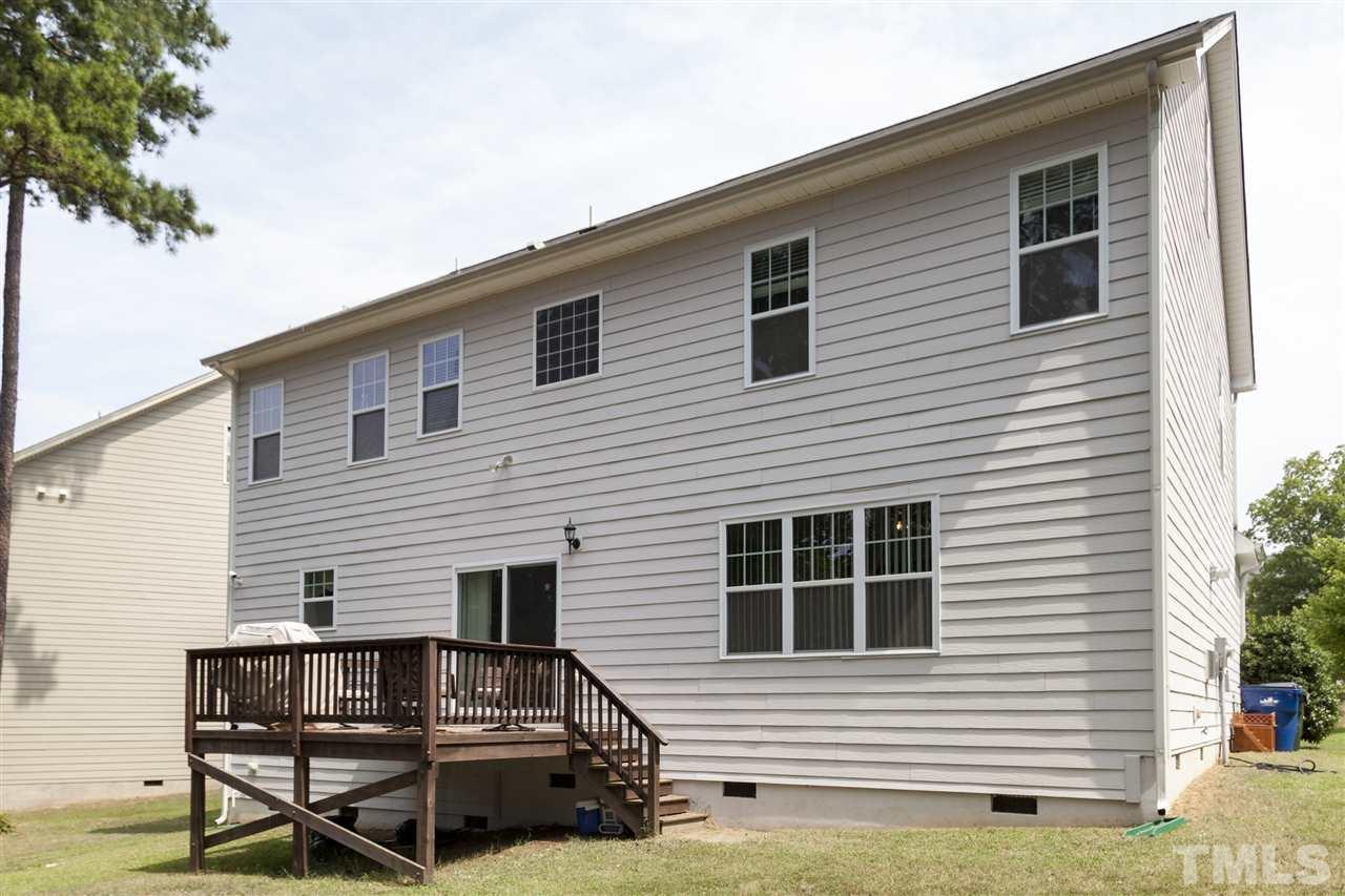 5607 Spring Glen Lane Raleigh, NC 27616 - Photo 21 of 21 a view of a house with a small yard and a large window