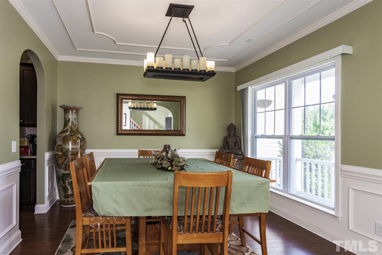 5607 Spring Glen Lane Raleigh, NC 27616 - Photo 4 of 21 a view of a dining room with furniture window and wooden floor