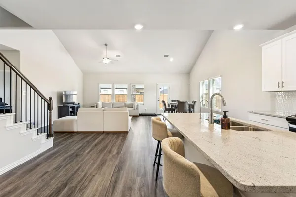 a view of house with a big yard