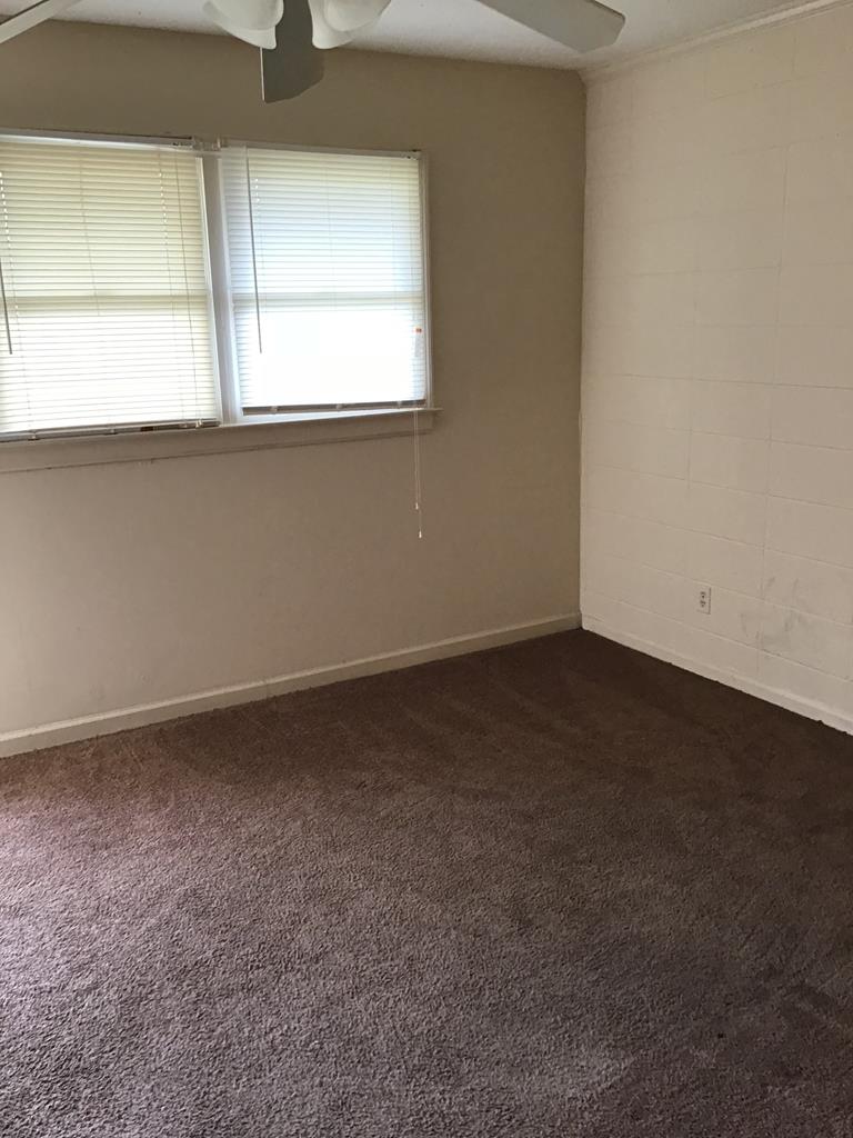 3981 Holly Avenue, Unit 2 Columbus, GA 31904 - Photo 6 of 8 an empty room with a window