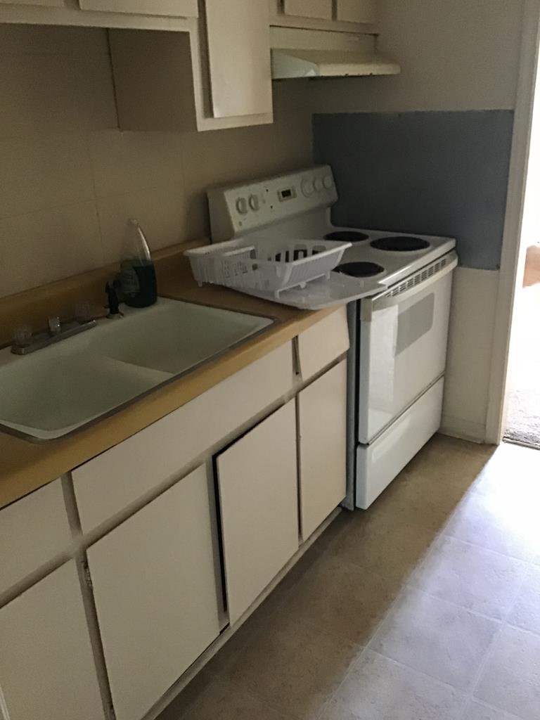 3981 Holly Avenue, Unit 2 Columbus, GA 31904 - Photo 8 of 8 a close view of utility room and stove