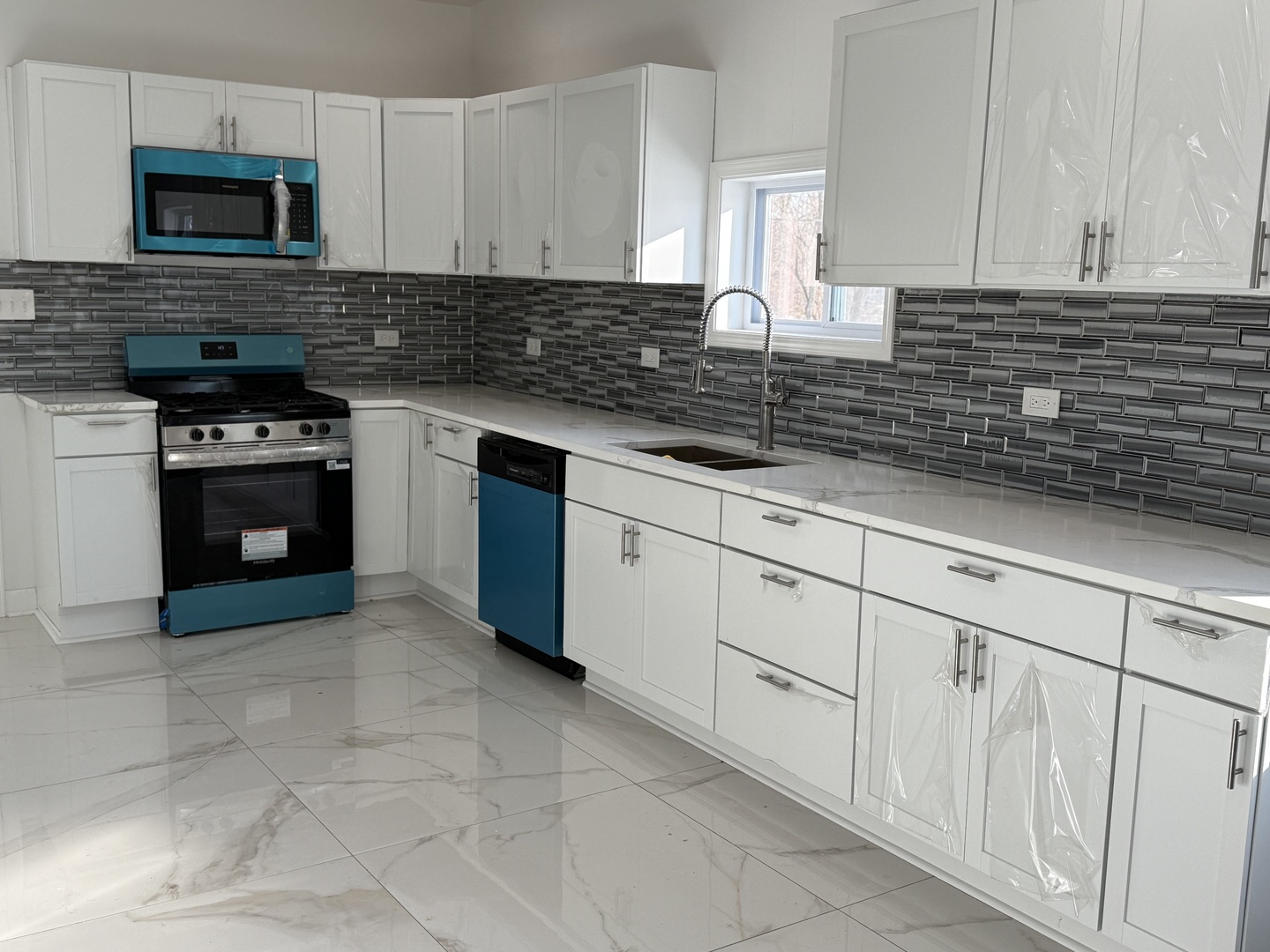 15351 3rd Avenue Phoenix, IL 60426 - Photo 2 of 12 a kitchen with stainless steel appliances granite countertop a sink stove and cabinets