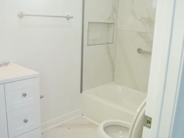 a bathroom with a sink and a shower