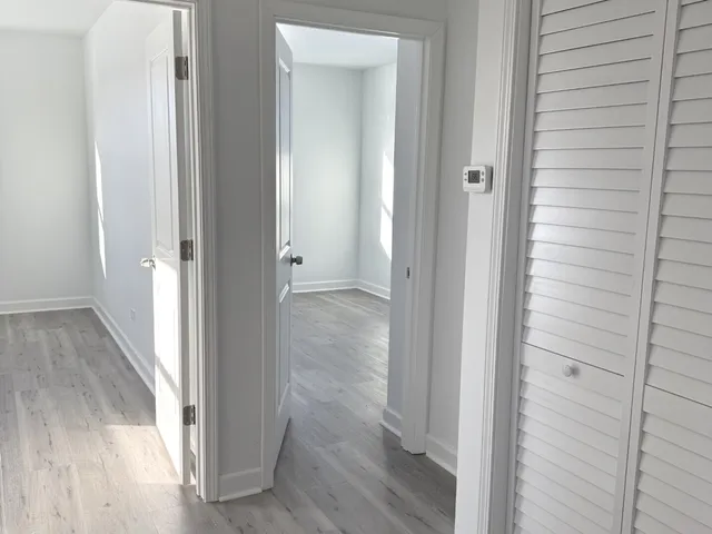 a view of a bathroom from a hallway