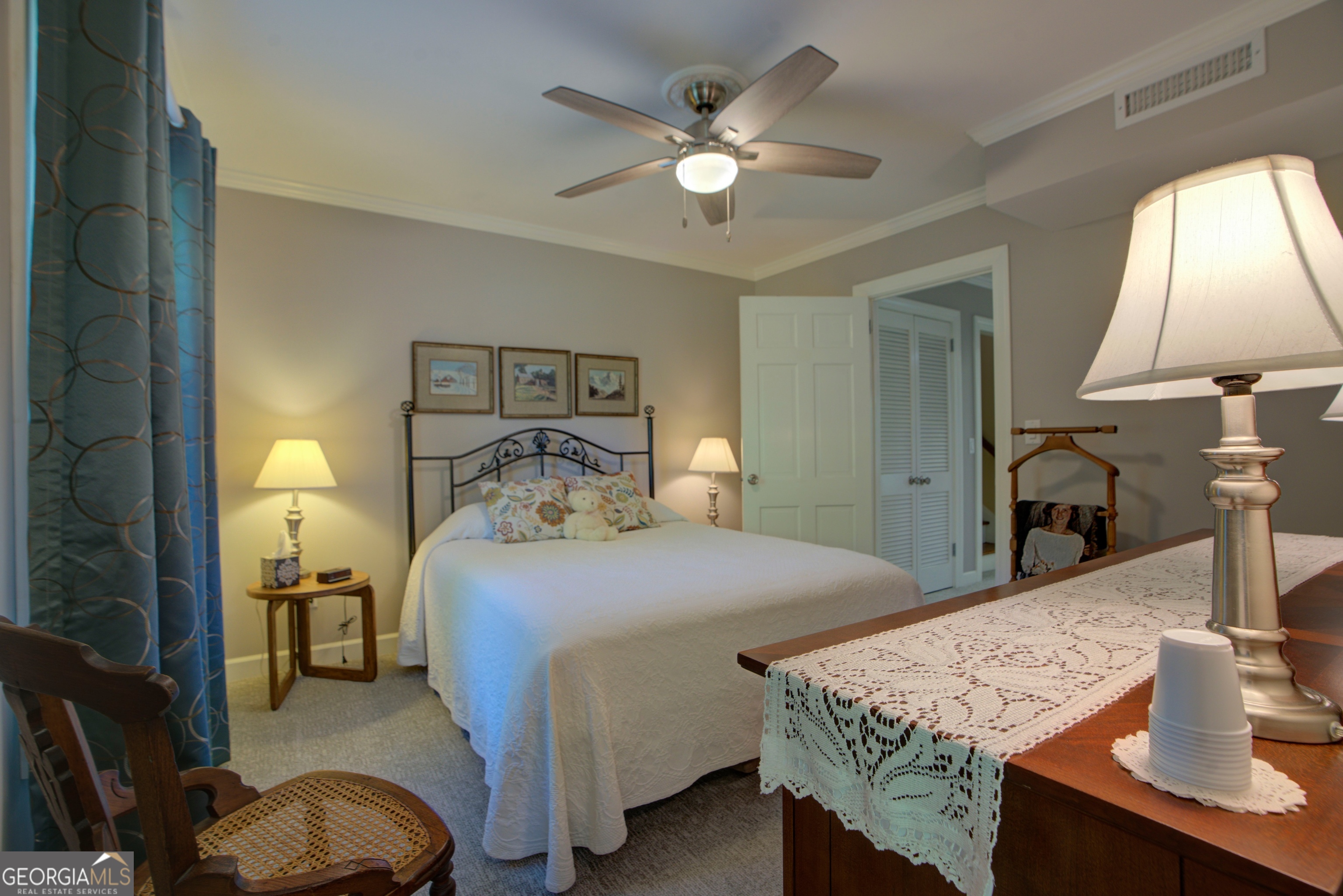 204 Green View Road Southwest Rome, GA 30165 - Photo 47 of 62 a bedroom with a bed and a chandelier