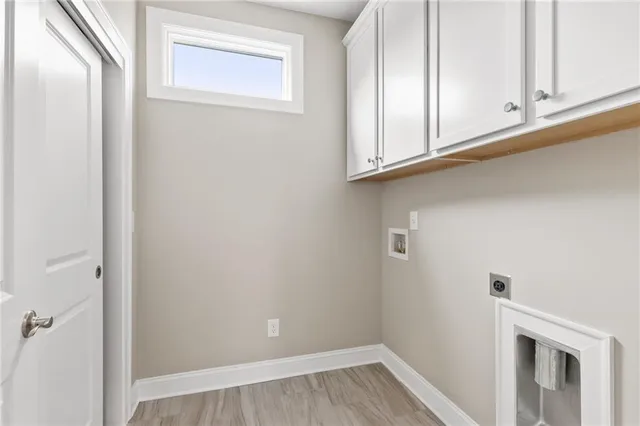 a view of room with wooden floor