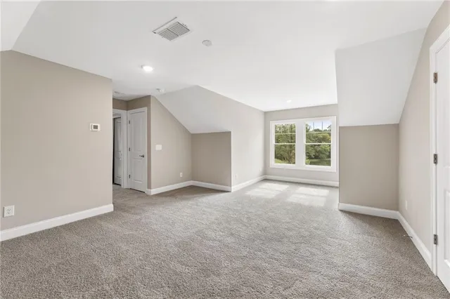 a bathroom with a sink mirror toilet and shower