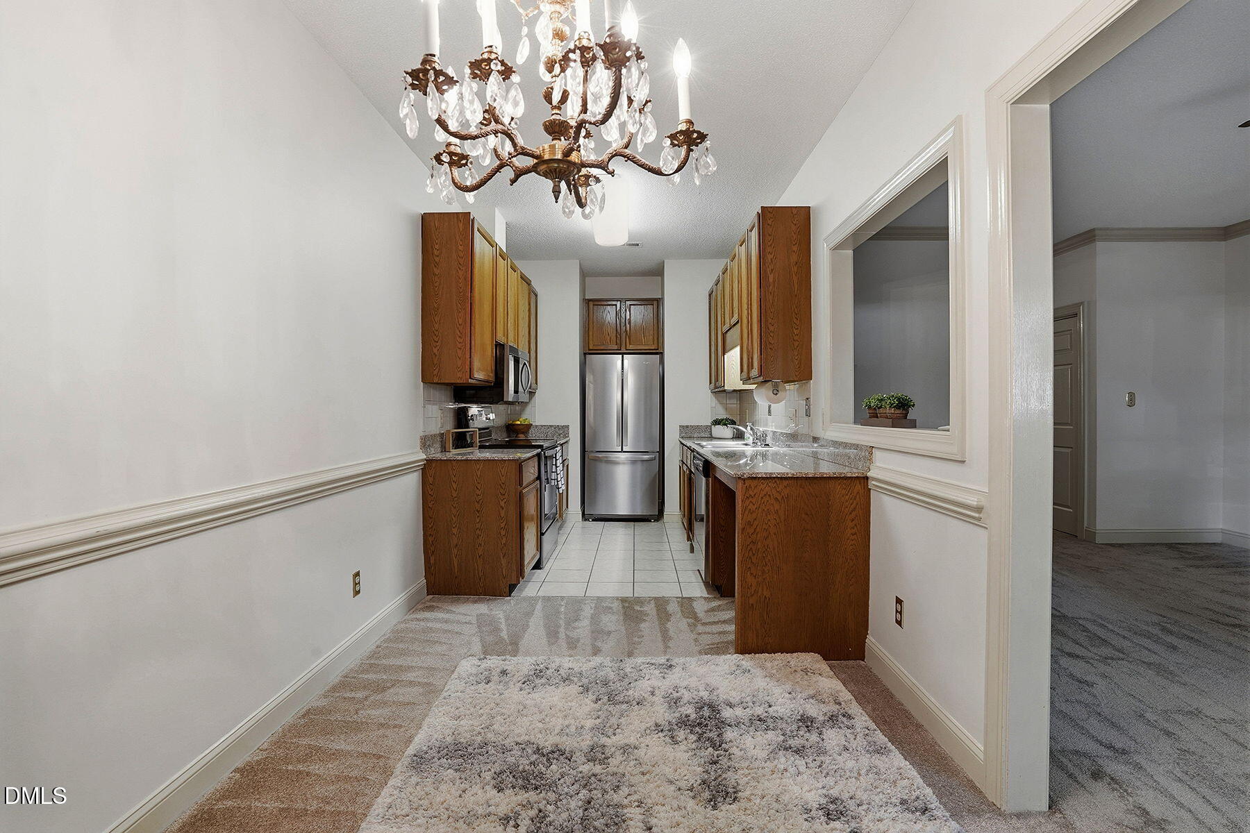 1210 Shadow Bark Court Raleigh, NC 27603 - Photo 14 of 29 a view of a kitchen with a sink and dishwasher