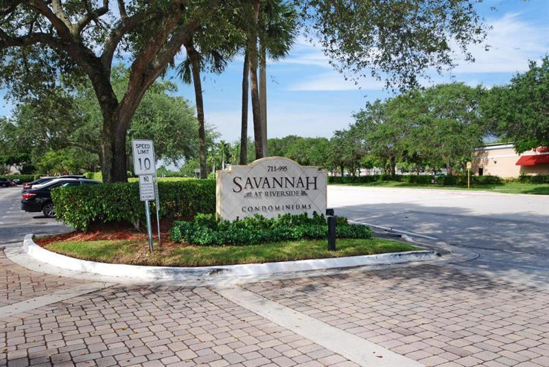 949 Riverside Drive, Unit 435 Coral Springs, FL 33071 - Photo 1 of 14 a sign board with a park bench