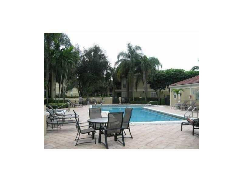 949 Riverside Drive, Unit 435 Coral Springs, FL 33071 - Photo 11 of 14 a view of backyard with sitting area