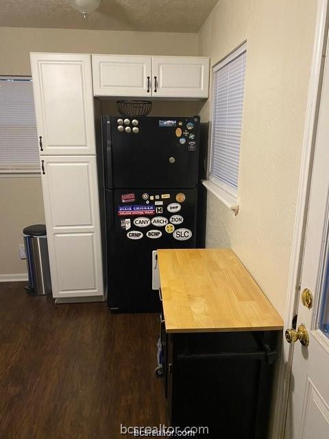 3005 1st Street Bryan, TX 77801 - Photo 6 of 18 a kitchen with a sink and a refrigerator