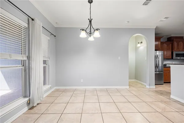 a view of a hallway with a chandelier