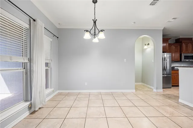 a view of a hallway with a chandelier