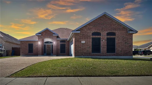 front view of a house with a yard