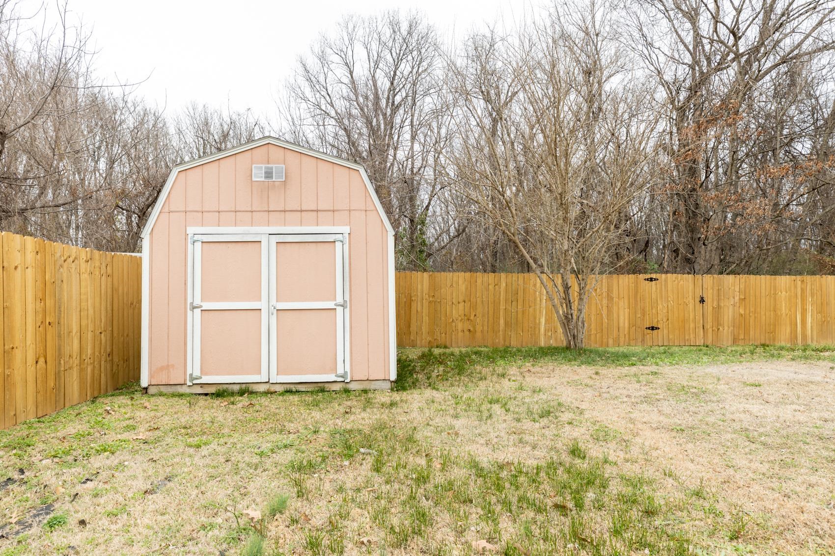 1820 West Holmes Road Memphis, TN 38109 - Photo 19 of 25 a view of a house with a wooden fence