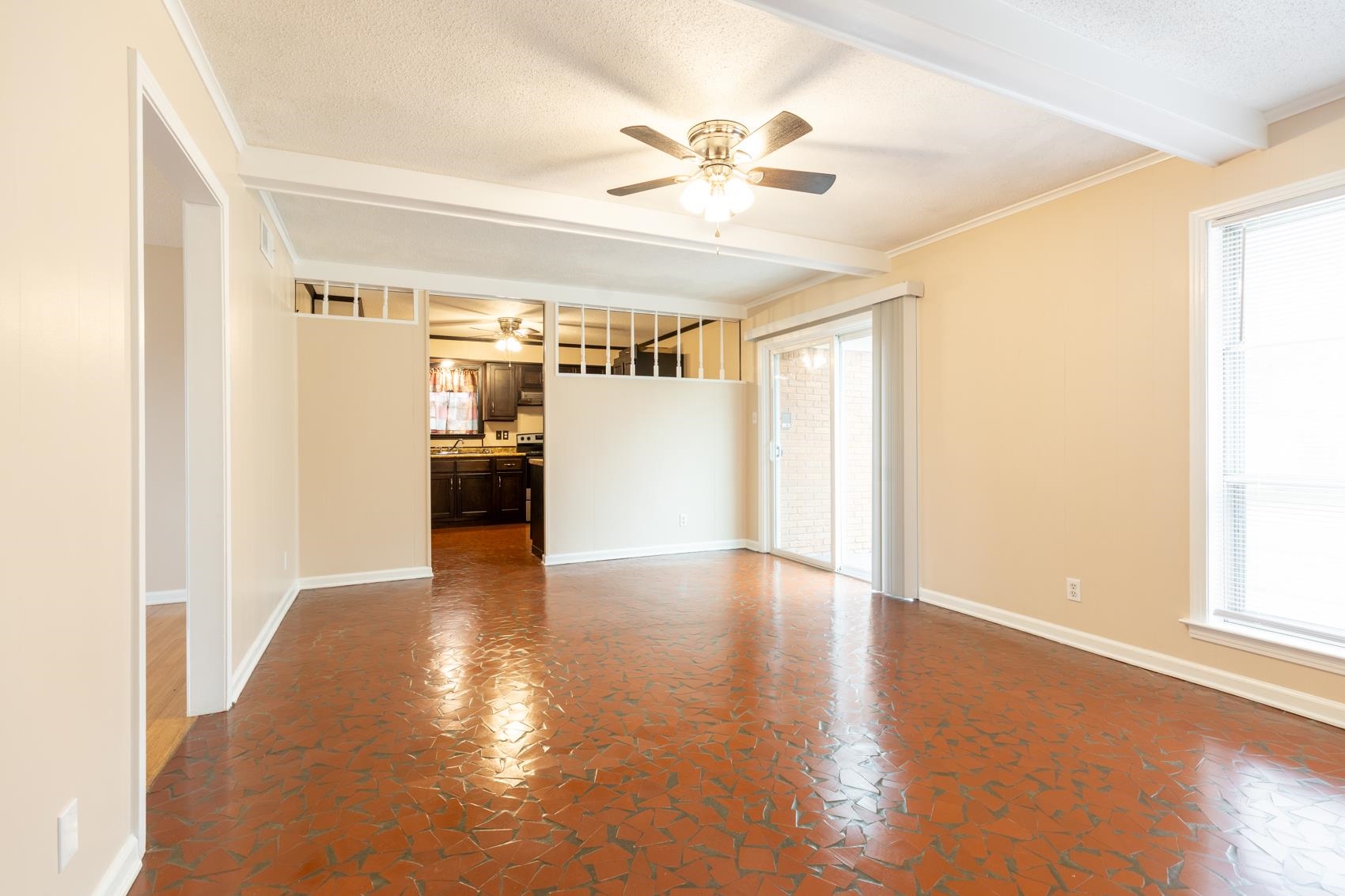 1820 West Holmes Road Memphis, TN 38109 - Photo 4 of 25 a view of a hallway with wooden floor and a window