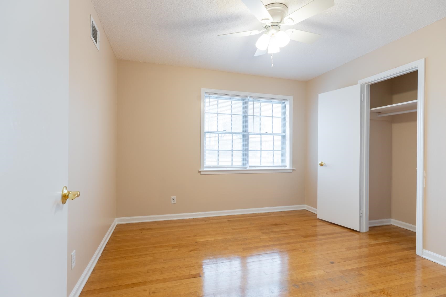 1820 West Holmes Road Memphis, TN 38109 - Photo 10 of 25 wooden floor in an empty room with a window
