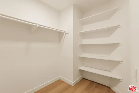 a view of an empty walk in closet