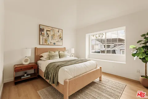 a bed room with a bed and a window