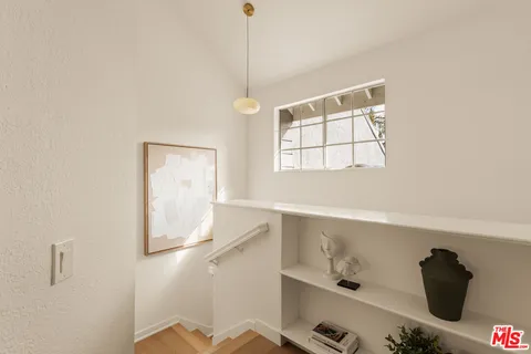 a bathroom with a window and a shower