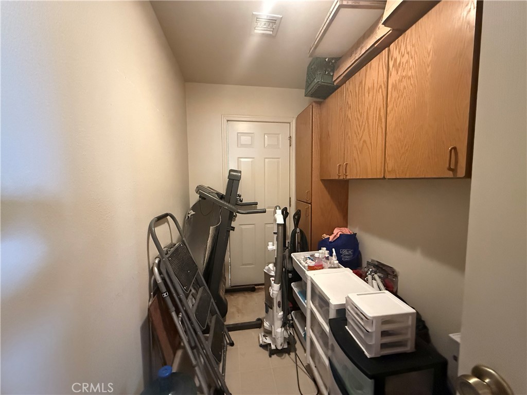 151080 Deerpath Road Big River, CA 92242 - Photo 11 of 24 a view of a workspace with furniture and a window