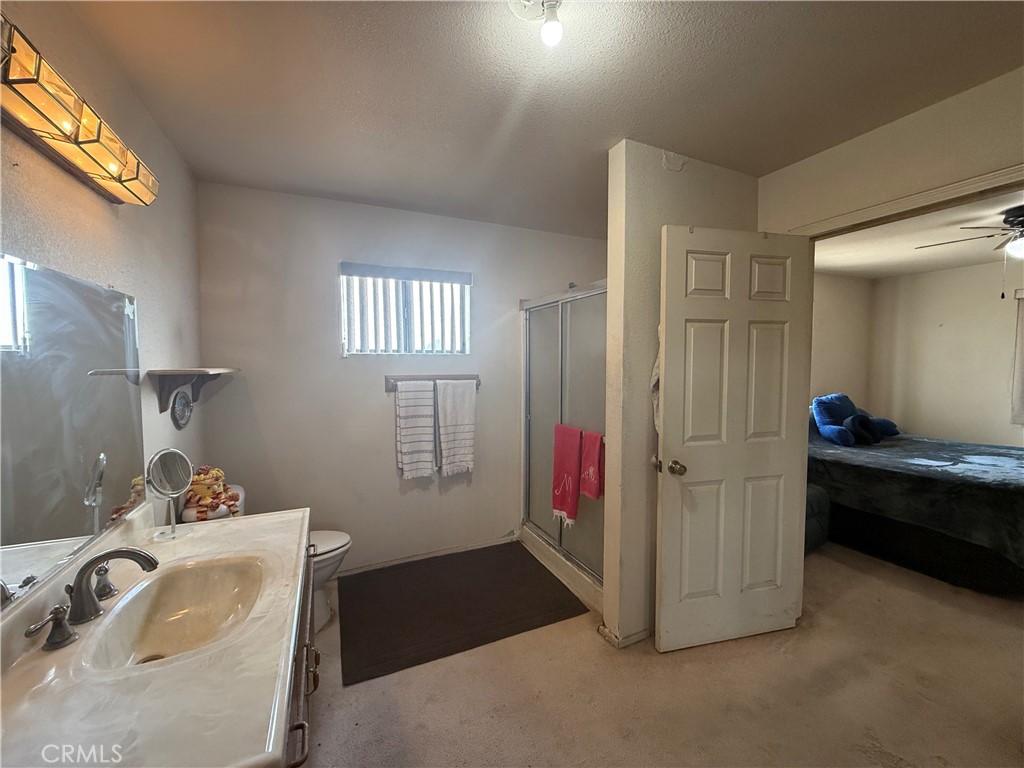 151080 Deerpath Road Big River, CA 92242 - Photo 13 of 24 a view of a room that has a bed and a window in it